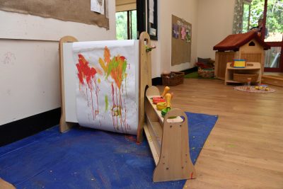 A child's easel with a painting on it