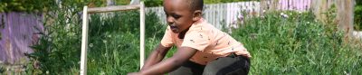 A little boy playing outside